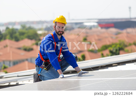 Man worker set installation and inspection standards of solar panels on roof of an industrial factory. Team technician inspection solar cell. Alternative innovation power environmental 126222684