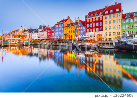 Copenhagen, Denmark. Nyhavn, Kobenhavn's iconic canal, colorful night water reflection. 126224609