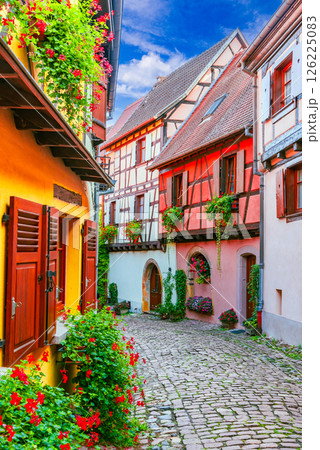 Eguisheim, France. French beautiful village, colorful half-timbered houses, cobblestone streets, medieval Alsace charm. 126225083