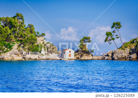 Parga, Greece. Panagia Chapel  and turquoise Ionian Sea waters, Greek holiday 126225089