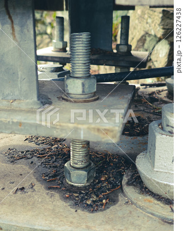 Reinforced concrete foundation with metal anchor bolts Reinforced concrete foundation with metal anchor bolts 126227438