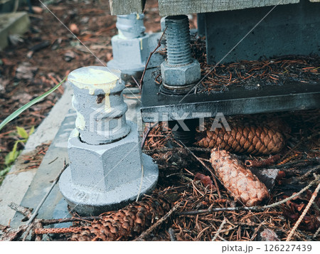 Reinforced concrete foundation with metal anchor bolts 126227439