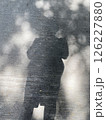 A shadow of woman on the concrete background 126227880