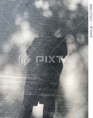 A shadow of woman on the concrete background 126227880