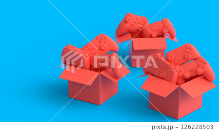 Set of gamer joysticks or gamepads in cardboard box on monochrome background 126228503