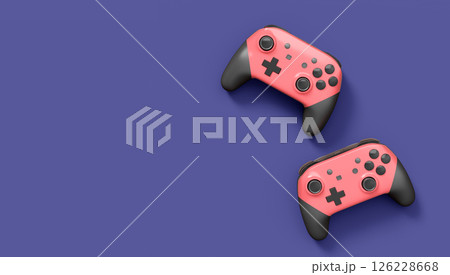 Realistic pink video game joysticks or gamepads on violet background 126228668
