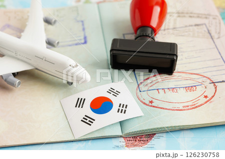 South Korea flag and passport with airplane for travel. 126230758
