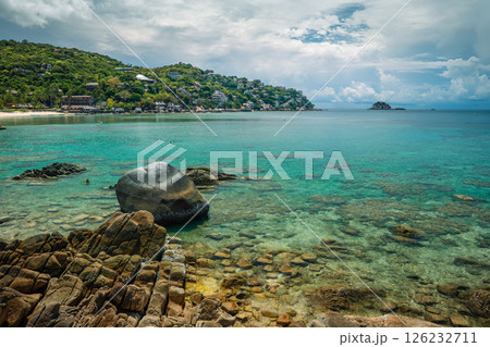 Summer vacation landscape of a bay and clear blue beach with rocks and corals on Koh Tao. 126232711