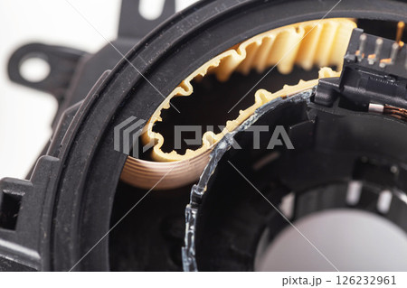disassembled broken steering column electrical cable on white background, isolate, close-up disassembled broken steering column electrical cable on white background, isolate, close-up 126232961