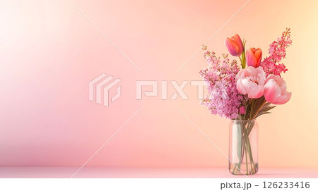 pink carnation in a glass vase on a pink pink carnation in a glass vase on a pink 126233416