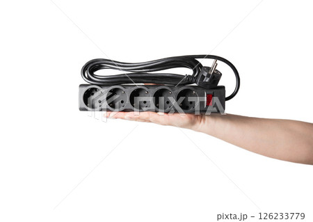 Modern black electrical filter with socket connectors on white background, on hand, insulator, isolate 126233779