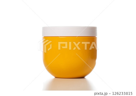Yellow jar with restorative and nourishing hair mask on a white background, isolate 126233815