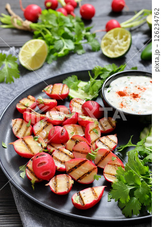 grilled radishes with cucumber slices and sauce grilled radishes with cucumber slices and sauce 126234762