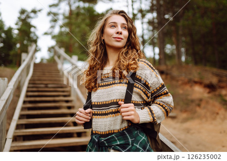 Attractive young woman enjoying fresh air on the lake. Travel, Hiking, nature 126235002