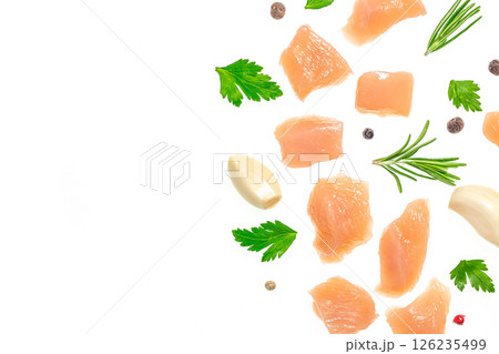 Raw chicken fillet chunks with spices, garlic and herbs isolated on white background. copy space, top view 126235499