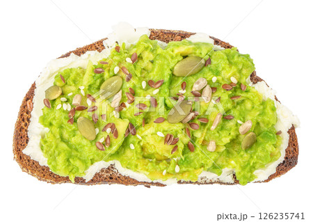 tasty avocado toast with rye bread, sliced avocado, pumpkin seeds isolated on white background. Top view tasty avocado toast with rye bread, sliced avocado, pumpkin seeds isolated on white background. Top view 126235741