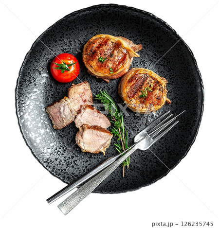 Medallions steaks from the beef tenderloin covered bacon grill on plate isolated on white background. Top view Medallions steaks from the beef tenderloin covered bacon grill on plate isolated on white background. Top view 126235745
