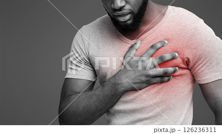 Heart attack. Young black man suffering from severe chest pain. Myocardial infarction disease, cropped 126236311