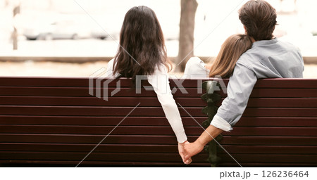Love Triangle. Cheating Boyfriend Hugging Girlfriend Holding Hands With Her Girl Friend Sitting On Bench Together In Park Outdoor. Back-View 126236464