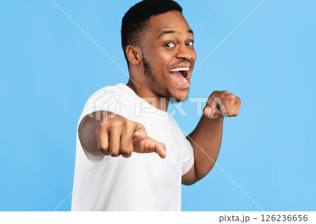 You're Next. Joyful Black Man Pointing Fingers At Camera Posing Over Blue Studio Background. 126236656