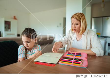 Learning moment between mother and daughter at home 126237312