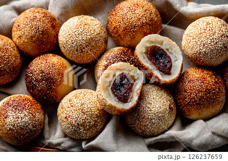 Chinese sweet rice balls covered in sesame seeds Chinese sweet rice balls covered in sesame seeds 126237659