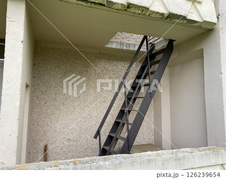 Metal stairs between floors of the building Metal stairs between floors of the building 126239654