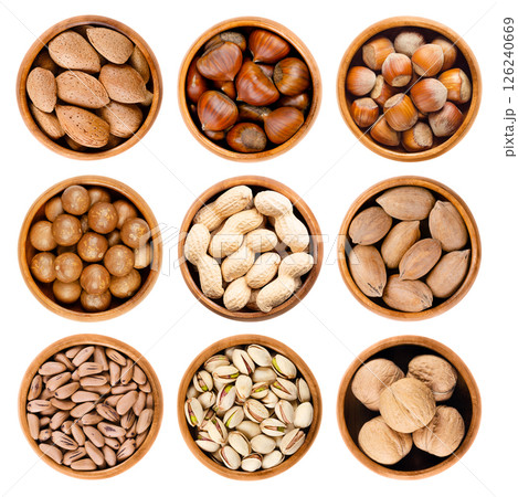 Nuts in shell, unshelled nuts in wooden bowls. Almonds, sweet chestnuts, and hazelnuts in the 1st row, macadamias, peanuts, and pecans in 2nd, pine nuts, pistachios, and walnuts in the 3rd row. Nuts in shell, unshelled nuts in wooden bowls. Almonds, sweet chestnuts, and hazelnuts in the 1st row, macadamias, peanuts, and pecans in 2nd, pine nuts, pistachios, and walnuts in the 3rd row. 126240669