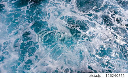 ocean surface foaming from waves, texture and shape of sea water, aerial view ocean surface foaming from waves, texture and shape of sea water, aerial view 126240853