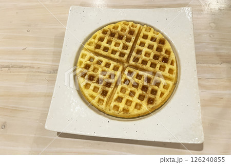 belgian waffles with maple syrup on a plate belgian waffles with maple syrup on a plate 126240855