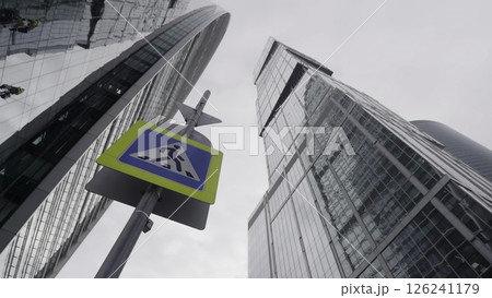 A Modern Urban Landscape with HighRise Buildings and a prominently displayed Traffic Sign. Action 126241179