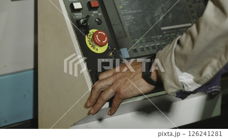 A Close Up View of the Control Panel Featuring the Operators Hand Engaged in Operation. Media A Close Up View of the Control Panel Featuring the Operators Hand Engaged in Operation. Media 126241281