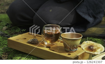A serene video capturing relaxation moments with tea in nature. Media 126241307