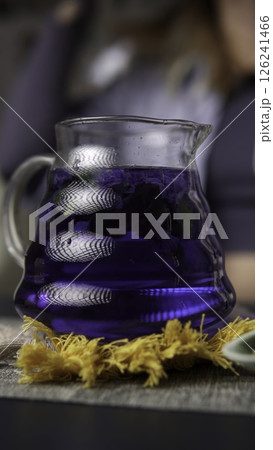 A Beautiful and Vibrant Blue Herbal Drink Served in a Glass Pitcher for Refreshment. Media 126241466