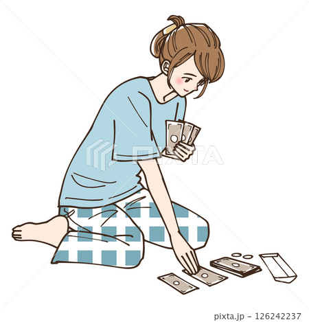 お金をどう使うか振り分けている女性 お金をどう使うか振り分けている女性 126242237