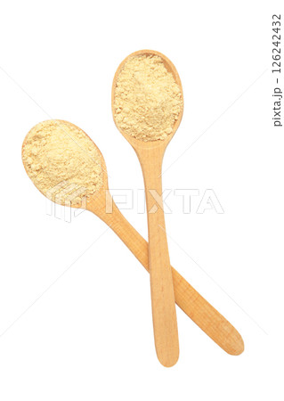 Wooden spoon with dried powder isolated on white background. Top view Wooden spoon with dried powder isolated on white background. Top view 126242432