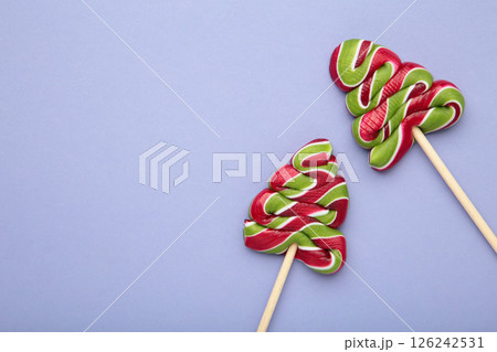 Christmas tree candies on purple background. Space for text Christmas tree candies on purple background. Space for text 126242531