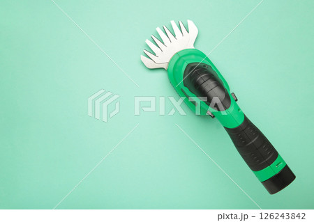 Hedge Trimmer New cordless hedge trimmer on mint background 126243842