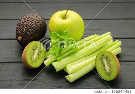 Kiwi, celery, apples from green smoothies. Detox concept, healthy food, diet, vegetarian. Smoothie on black 126244488