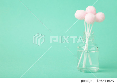 Air freshener on mint. White aroma diffuser bottle with sticks. Minimalism Air freshener on mint. White aroma diffuser bottle with sticks. Minimalism 126244625