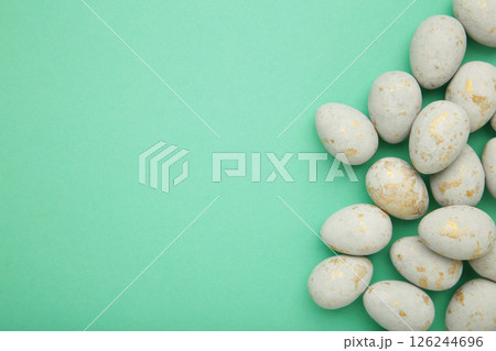 Easter eggs in a speck on mint background. Easter holiday composition. Space for text 126244696