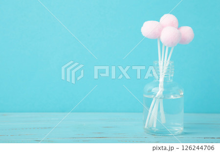 Air freshener on blue. White aroma diffuser bottle with sticks. Minimalism 126244706