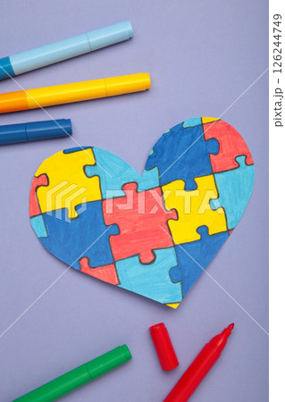 World Autism Awareness day, mental health care concept with puzzle or jigsaw pattern on heart World Autism Awareness day, mental health care concept with puzzle or jigsaw pattern on heart 126244749