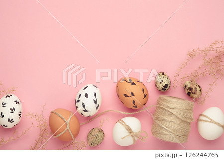 Composition with Easter eggs on pink background Composition with Easter eggs on pink background 126244765