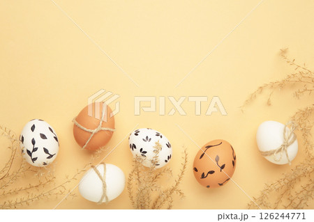 Composition with Easter eggs on beige background 126244771