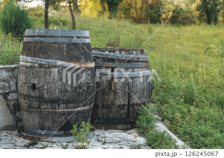 Old wine barrels in the yard of a winery 126245067