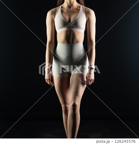 athletic female body on dark background, fitness woman, athletic girl torso athletic female body on dark background, fitness woman, athletic girl torso 126245576