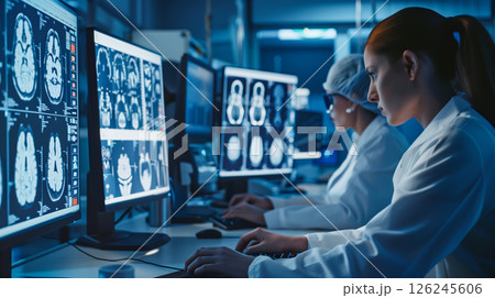 Professional medical doctors working in hospital office using computer technology. 126245606