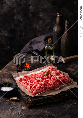 Raw minced meat on dark background 126245961