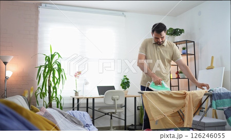 Relaxing afternoon ironing in a cozy home office 126246055